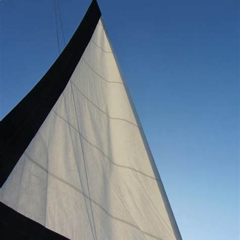Headsail edge fitted with a dark UV strip, demonstrating proper leech protection.