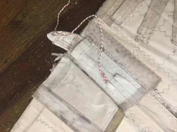 Worn batten pocket in need of some repair and Velcro replacement.